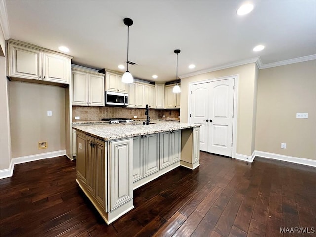 kitchen featuring backsplash, stainless steel microwave, and dark wood-type flooring