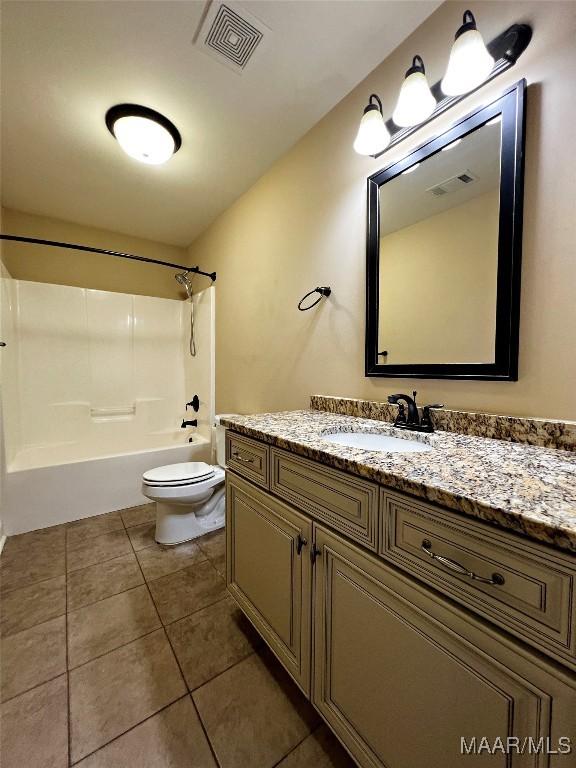 bathroom featuring tile patterned floors, visible vents, toilet, and vanity