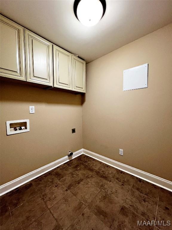 laundry area featuring electric dryer hookup, baseboards, cabinet space, and washer hookup