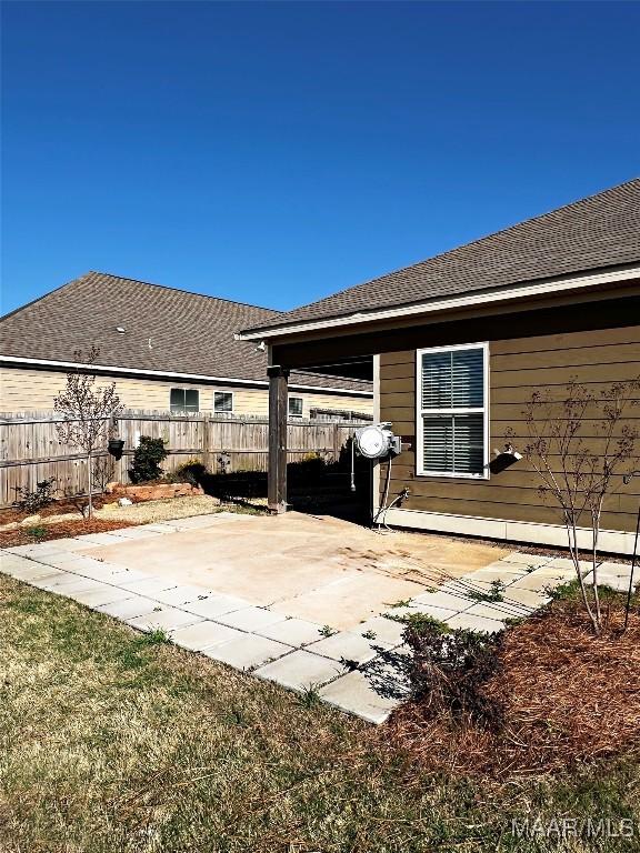 view of patio / terrace featuring fence