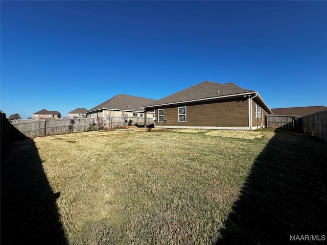 view of yard featuring a fenced backyard