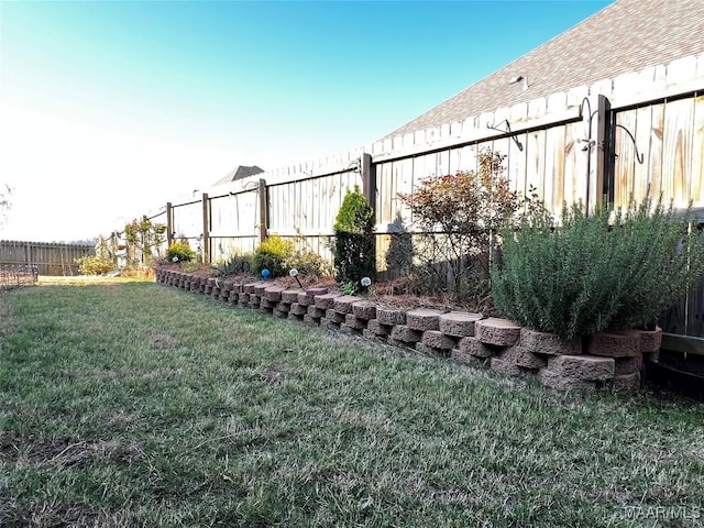 view of yard with a fenced backyard