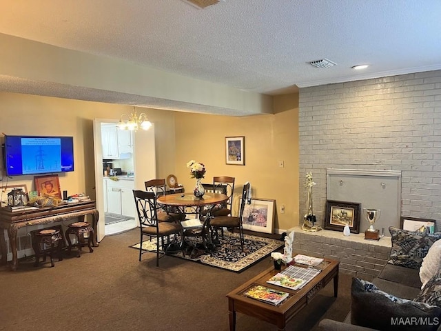 living room with visible vents, carpet floors, a textured ceiling, and a fireplace