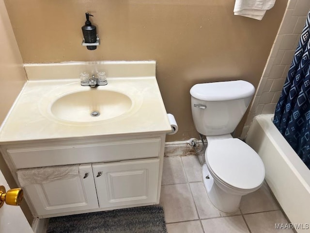 full bathroom featuring tile patterned flooring, toilet, and vanity