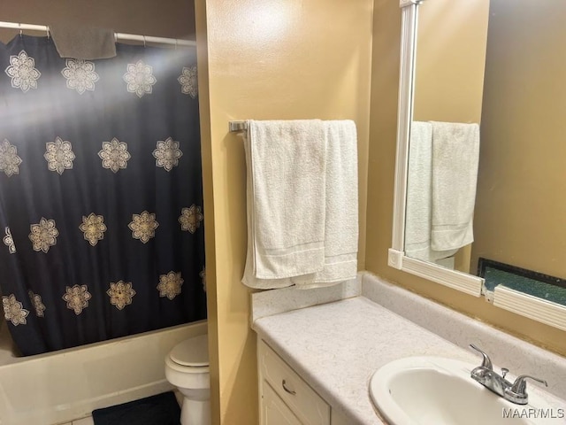 bathroom with toilet, vanity, and shower / bathtub combination with curtain