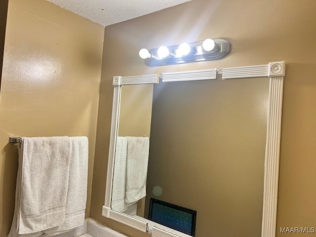 bathroom with a textured ceiling