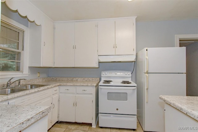 kitchen with white appliances, a sink, light countertops, white cabinets, and under cabinet range hood