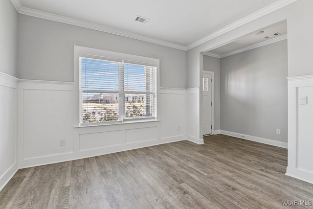5619 Wyatt Ct, Montgomery, AL 36116 - empty room with visible vents, ornamental molding, and wood finished floors