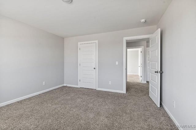 5619 Wyatt Ct, Montgomery, AL 36116 - unfurnished bedroom featuring a closet, baseboards, and carpet