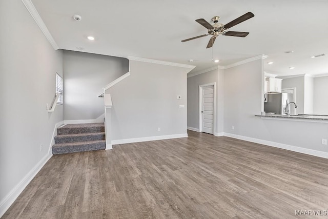 5619 Wyatt Ct, Montgomery, AL 36116 - unfurnished living room with ornamental molding, a ceiling fan, and wood finished floors