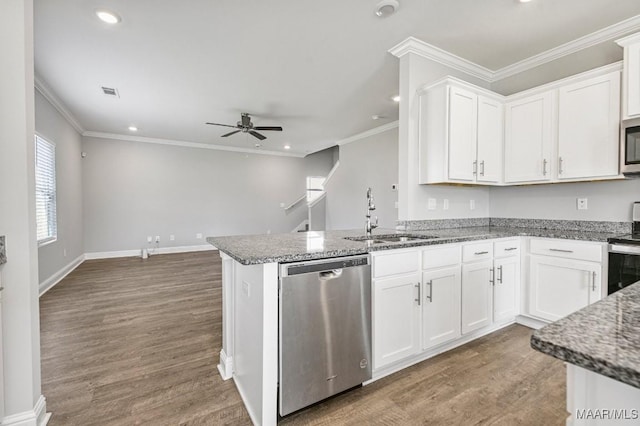5619 Wyatt Ct, Montgomery, AL 36116 - kitchen with stone counters, a sink, ceiling fan, stainless steel appliances, and white cabinets