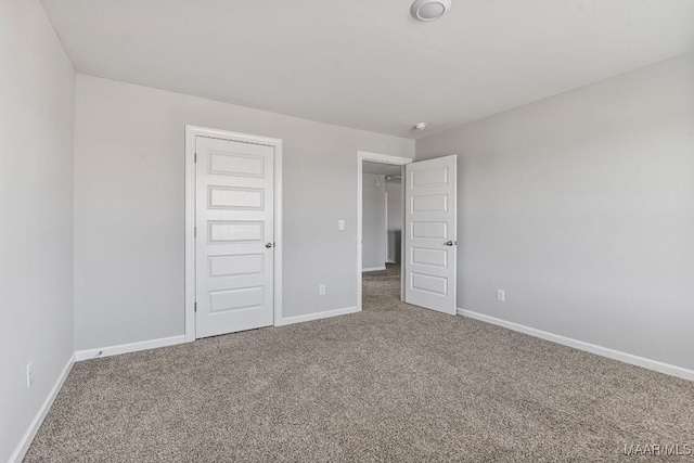 5619 Wyatt Ct, Montgomery, AL 36116 - unfurnished bedroom featuring baseboards and carpet floors