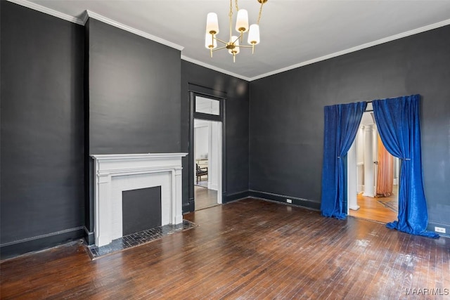 unfurnished living room with hardwood / wood-style floors, baseboards, a fireplace with flush hearth, crown molding, and a notable chandelier