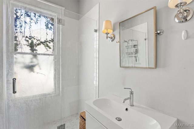 bathroom with vanity and a stall shower