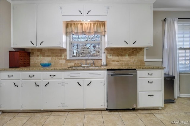 kitchen featuring stainless steel dishwasher, crown molding, a healthy amount of sunlight, and a sink