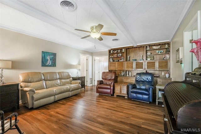 living room with crown molding, wood finished floors, visible vents, and ceiling fan