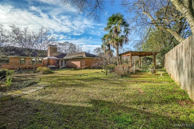 view of yard with fence