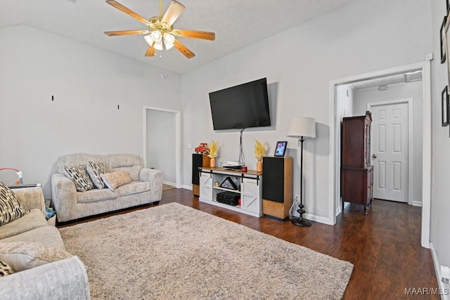 living area featuring lofted ceiling, baseboards, dark wood-style flooring, and ceiling fan