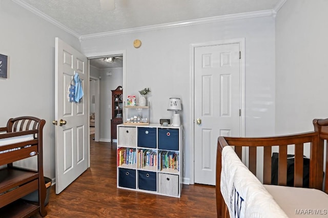 bedroom featuring dark wood finished floors, a textured ceiling, and ornamental molding