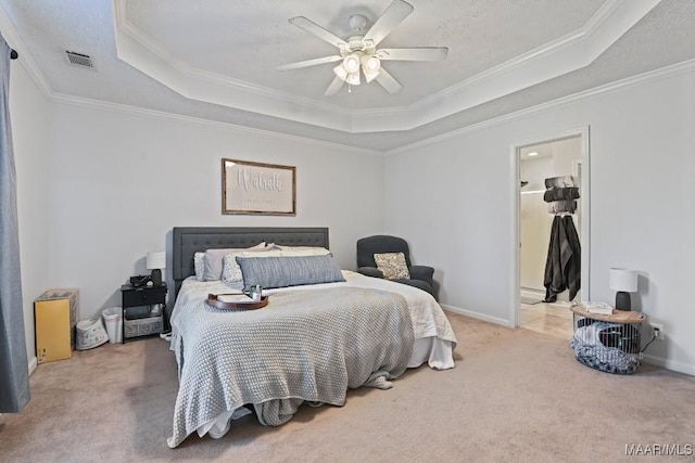 carpeted bedroom featuring a tray ceiling, a textured ceiling, visible vents, and ornamental molding