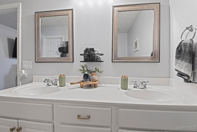 full bathroom with double vanity and a sink