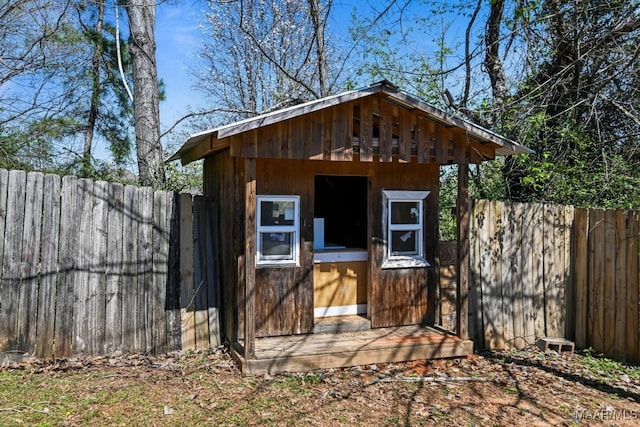 view of shed with a fenced backyard