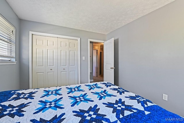 bedroom featuring a closet and a textured ceiling