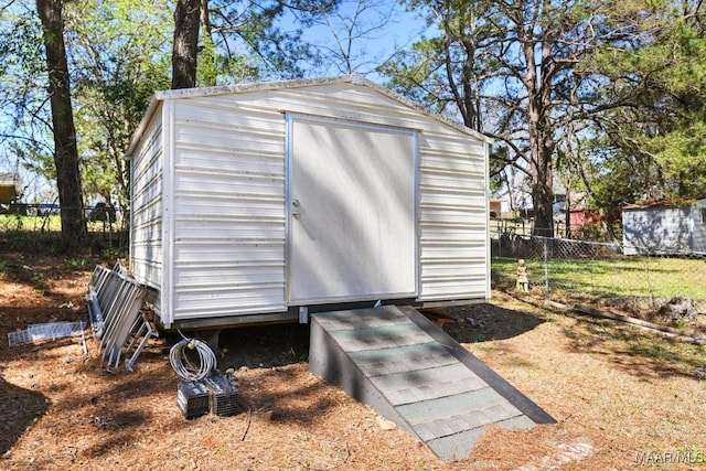 view of shed with fence