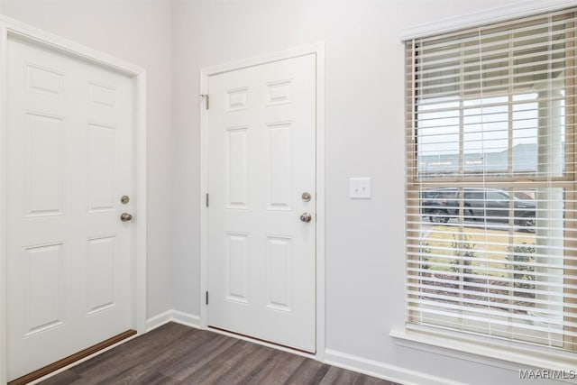 entrance foyer with baseboards and dark wood-style floors