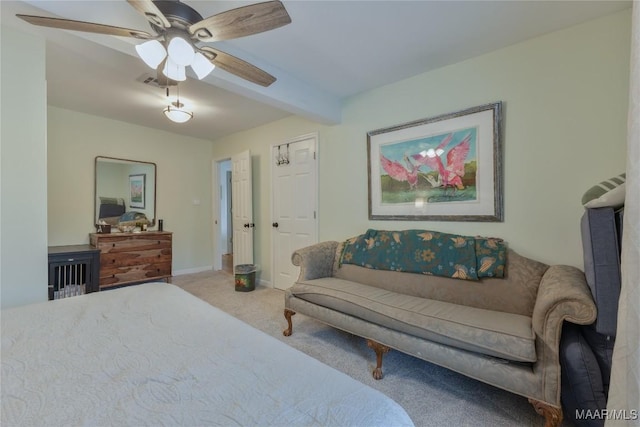 carpeted bedroom featuring beam ceiling, visible vents, baseboards, and a ceiling fan