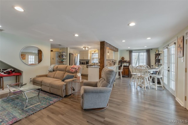 living area featuring recessed lighting and light wood finished floors