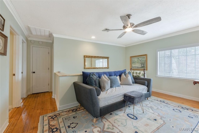 living area with visible vents, baseboards, ornamental molding, and light wood finished floors