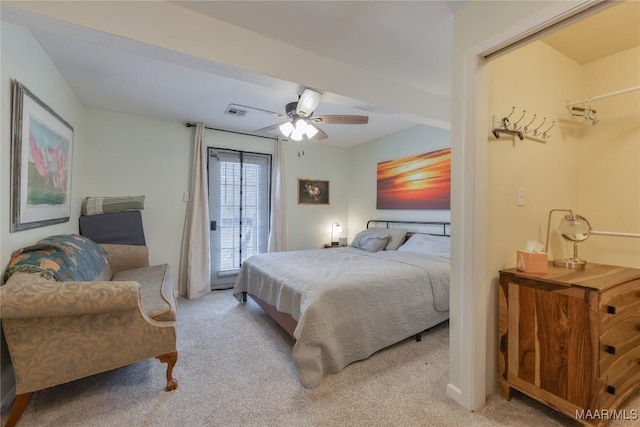 bedroom with visible vents, light colored carpet, access to exterior, and a ceiling fan