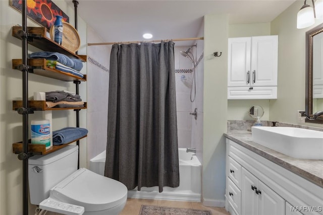 full bath with tile patterned floors, toilet, vanity, and shower / bathtub combination with curtain