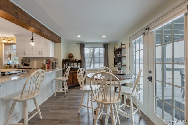 dining room with recessed lighting and dark wood-style flooring