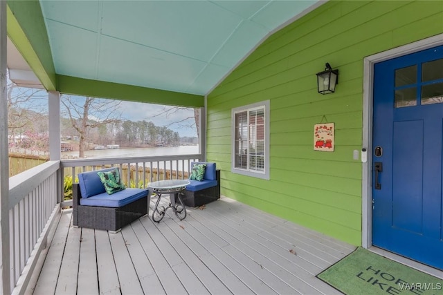 wooden deck with a water view