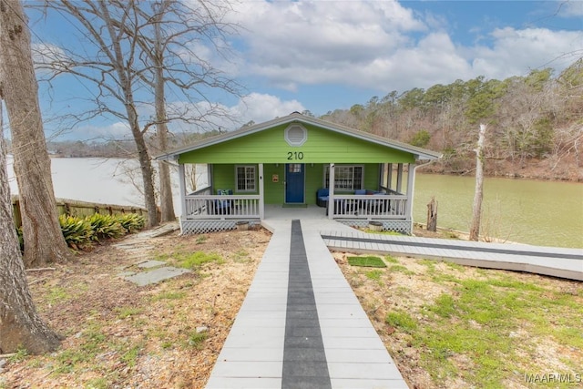 bungalow featuring a water view and a porch