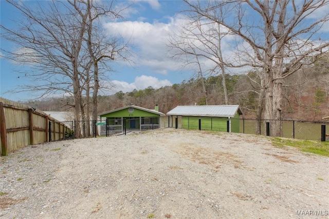 view of yard with an outbuilding and fence