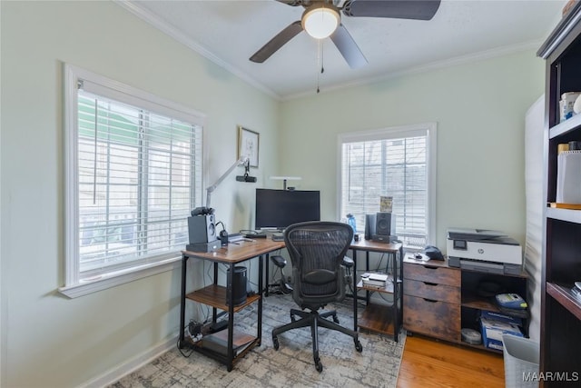 office space with a wealth of natural light, wood finished floors, and ornamental molding