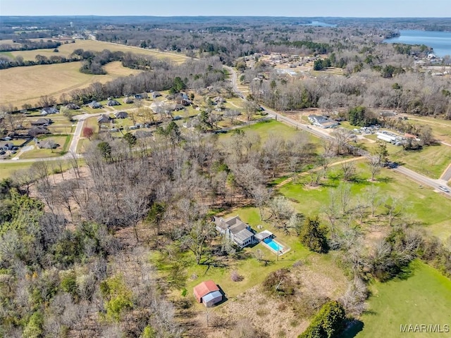 birds eye view of property with a rural view