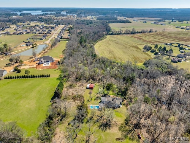 birds eye view of property with a rural view