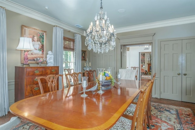 dining area with an inviting chandelier, crown molding, and visible vents