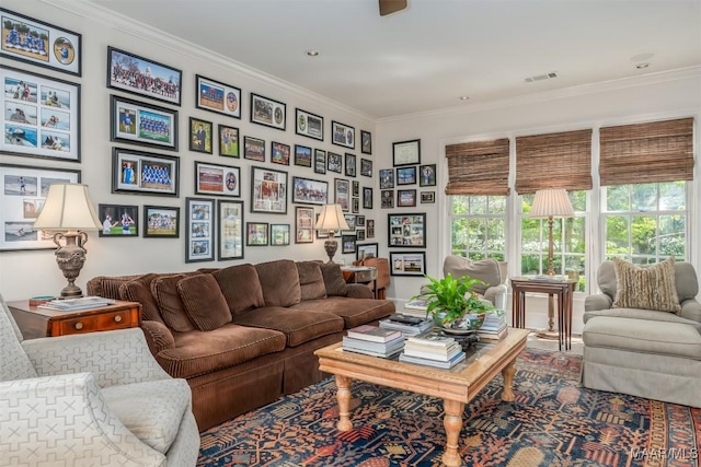 living room featuring visible vents and ornamental molding