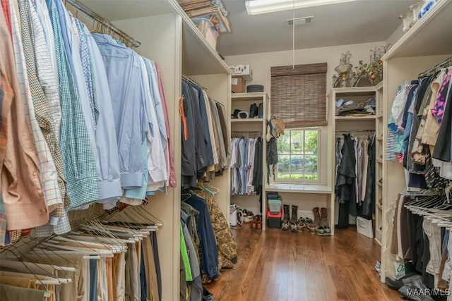 walk in closet featuring visible vents and wood finished floors