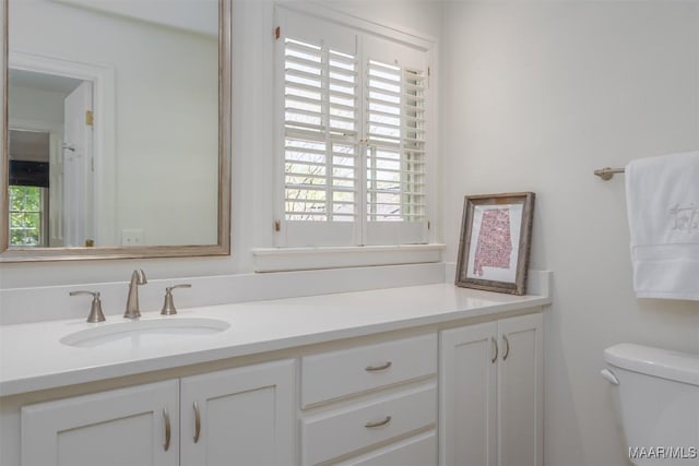 bathroom with vanity and toilet