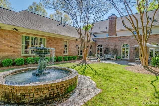 exterior space with french doors and a patio area