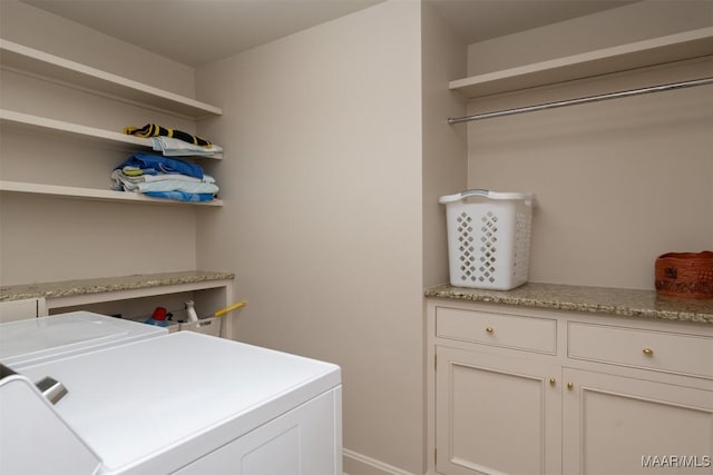 laundry area with cabinet space and washing machine and clothes dryer