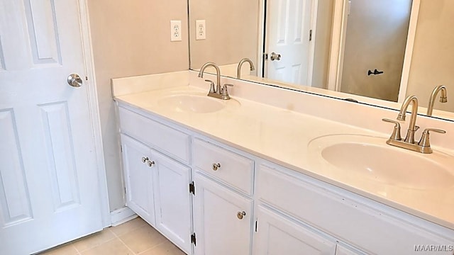 full bathroom with tile patterned floors, double vanity, and a sink