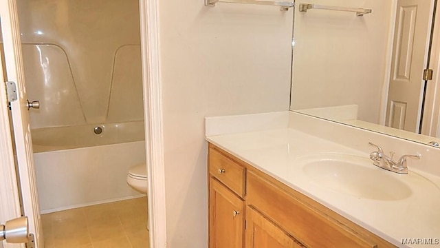 full bath featuring toilet,  shower combination, vanity, and tile patterned flooring