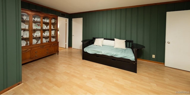 bedroom with visible vents and light wood-style floors